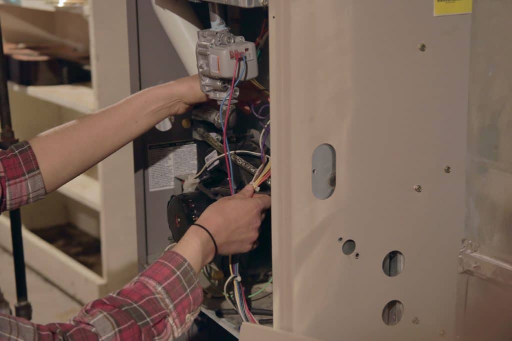 technician working on furnace